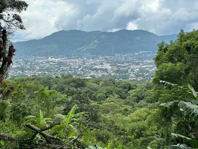 a view of a city from a mountain at Zona de Camping con casa de campo in San Salvador