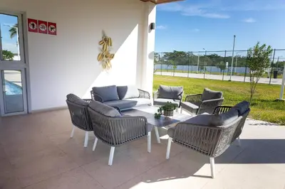 a patio with a table with chairs and a couch at Casita Marsol in San Miguel in San Miguel