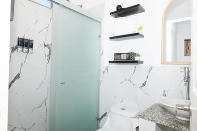a bathroom with a toilet and a sink at Casita Marsol in San Miguel in San Miguel