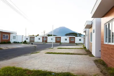 a street with buildings and a mountain in the background at Casita Marsol in San Miguel in San Miguel