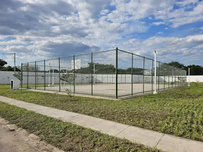 a tennis net on a tennis court in a field at Residence in San Miguel in San Miguel