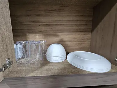 a shelf with plates and glass items on it at Residence in San Miguel in San Miguel