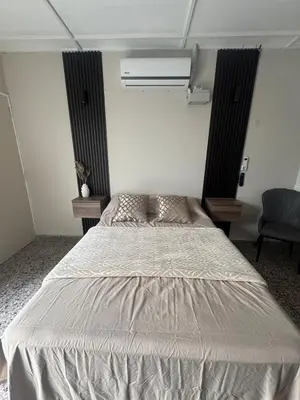 a bedroom with a large bed in a room at San Benito Executive Suite, luxury, security in San Salvador