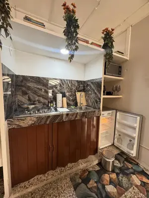 a kitchen with a sink and a counter top at San Benito Executive Suite, luxury, security in San Salvador