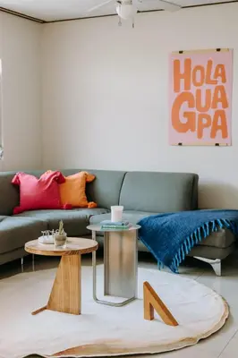 a living room with a couch and a table at Española - Apartamentos España in San Salvador