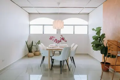 a dining room with a table and chairs at Española - Apartamentos España in San Salvador