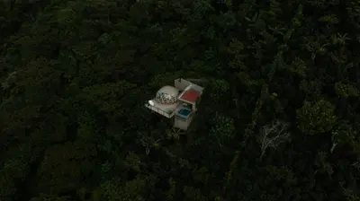 an aerial view of a house in the middle of a forest at Kafen Hotel in Juayúa