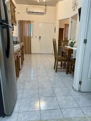 a kitchen and dining room with a tile floor at Casa de Descanso en la Villa Panamericana in San Miguel