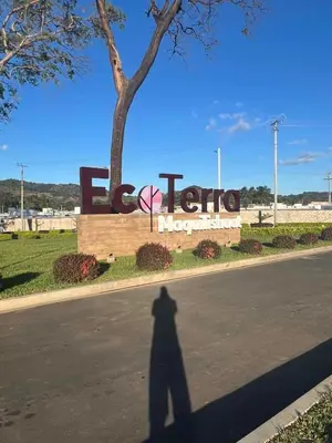 a shadow of a person standing in front of a sign at Lovely 2BDR home in EcoTerra, Santa Ana in Santa Ana
