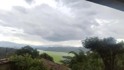 a view of a valley with a green field at Casa lichis habitación basica in Suchitoto