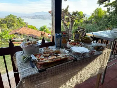 a table with a buffet of food on a balcony at Casa lichis habitación basica in Suchitoto