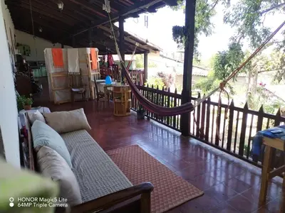 a living room with a couch on a porch at Casa lichis habitación basica in Suchitoto