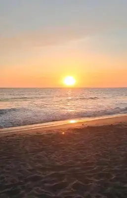 a sunset on a beach with the ocean at Beachfront- El Torogoz del Pimental in La Esmeralda