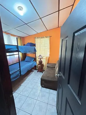 a room with a bunk bed and a door at Casa de Montaña en Los Naranjos in Los Naranjos