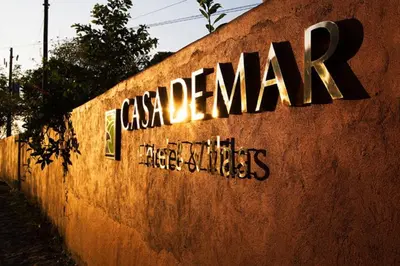 a sign on the side of a wall with the words csa companies at Casa de Mar Hotel And Villas in La Libertad