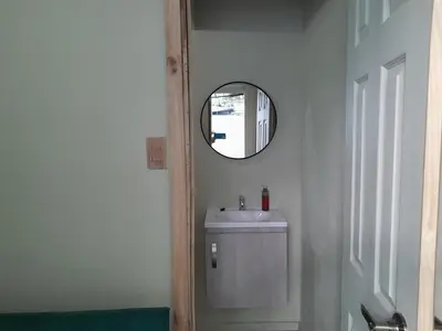 a bathroom with a sink and a mirror at Casa en zona privada in San Salvador