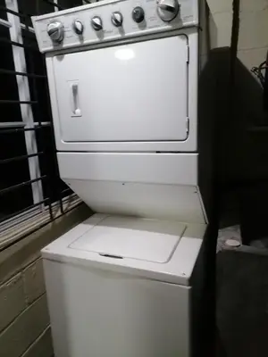 an old white stove sitting next to a window at Casa en zona privada in San Salvador