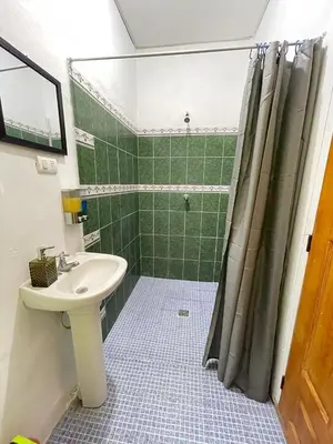 a bathroom with a sink and a shower at Tunco Bambú Room 1 in Tamanique