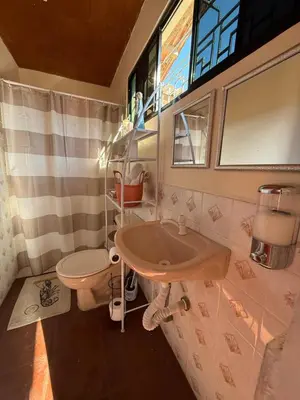 a bathroom with a sink and a toilet at Casa DUNA 3 in Playa San Blas