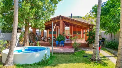 a house with a bath tub in the yard at Casa DUNA 3 in Playa San Blas
