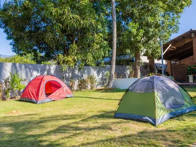 two tents sitting in the grass in a yard at Casa DUNA 4 in La Libertad
