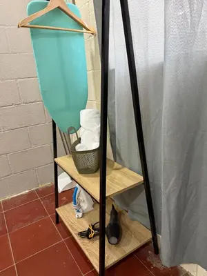 a mirror with a shelf with a blue object on it at Casa DUNA 4 in La Libertad