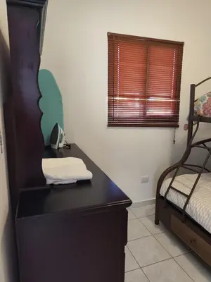 a room with a desk with a bed and a window at Luxury Living apartment P5314 in San Miguel