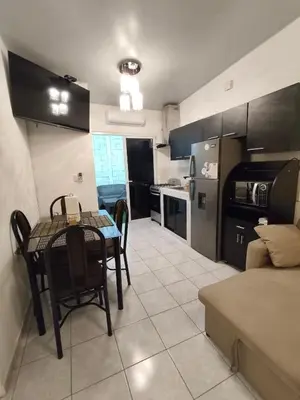 a kitchen and dining room with a table and chairs at Luxury Living apartment P5314 in San Miguel