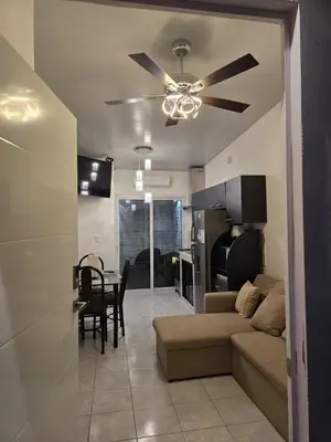 a living room with a couch and a ceiling fan at Luxury Living apartment P5314 in San Miguel