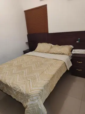 a bed in a bedroom with a wooden headboard at Luxury Living apartment P1620 in San Miguel