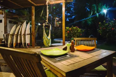a wooden table with a bunch of surfboards on it at Eco del Mar in La Libertad