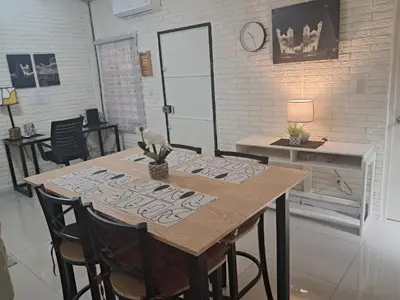 a dining room with a table and chairs at La Cima House-Studio in San Salvador