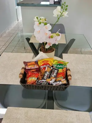 a basket of chips and snacks on a table at Familiar cómodo centrico in San Salvador