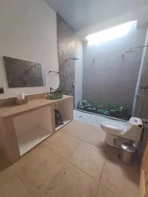 a bathroom with a toilet and a sink and a shower at Residence in Salinitas, Los Cobanos in Los Cóbanos