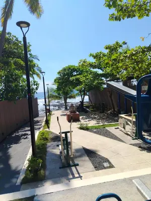 a sidewalk with two chairs and a street light at Zonte Rooftide Studio in ChiltiupÃ¡n
