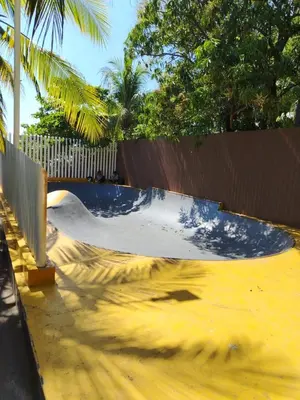 a skateboard ramp in a skate park with a fence at Zonte Rooftide Studio in ChiltiupÃ¡n