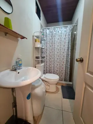 a bathroom with a sink and a toilet at Zonte Rooftide Studio in ChiltiupÃ¡n
