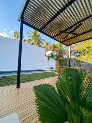 a wooden deck with a view of the ocean at Villa Uma 50m to Zonte wave 2Bdr in El Zonte