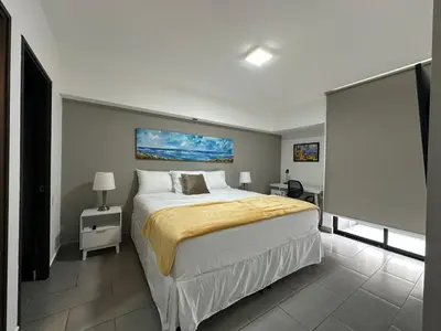 a bedroom with a large bed in a room at Apartamento amueblado Condado Santa Rosa Santa Tecla La Libertad in Nanastepeque