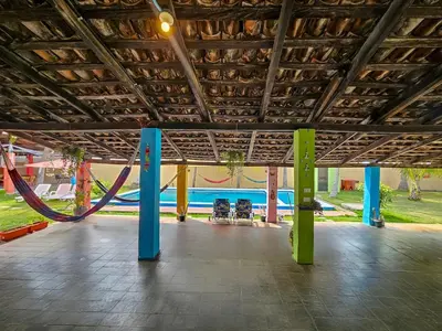 a large room with a playground with a slide at Rancho Samba do Sol in Acajutla