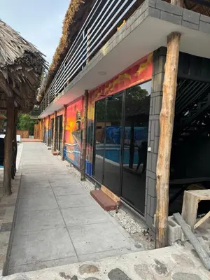 a building with a mural on the side of it at Container house in La Esmeralda