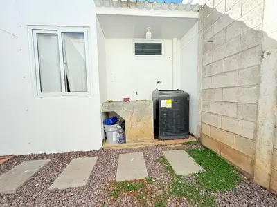 an outside corner of a white building with a water heater at House for entire families in a private area in San Miguel