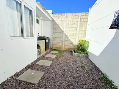 a walkway next to a white building with a door at House for entire families in a private area in San Miguel