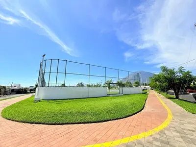a batting cage on a field of grass on a road at House for entire families in a private area in San Miguel