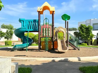 a playground with a slide in a park at House for entire families in a private area in San Miguel