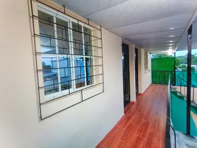a hallway of a house with windows and a balcony at Casa Independencia de Santa Ana in Santa Ana