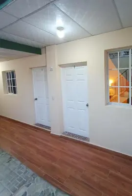 an empty room with white walls and wood floors at Casa Independencia de Santa Ana in Santa Ana