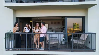 a group of people standing on a balcony at View of The Capital, Escalon SV in San Salvador