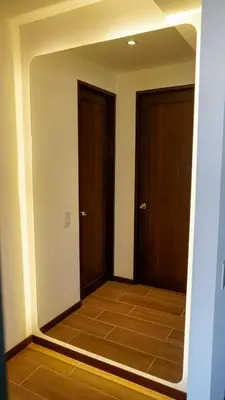 a hallway with two doors and a tile floor at View of The Capital, Escalon SV in San Salvador