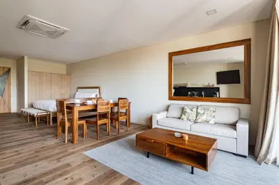 a living room with a couch and a table at Spacious Apartment with Balcony in El Zonte